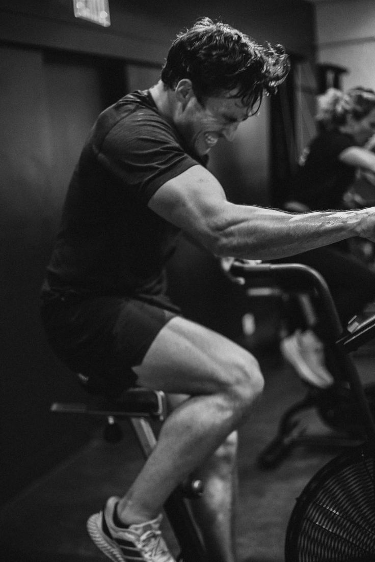 Athlete training hard on an air bike