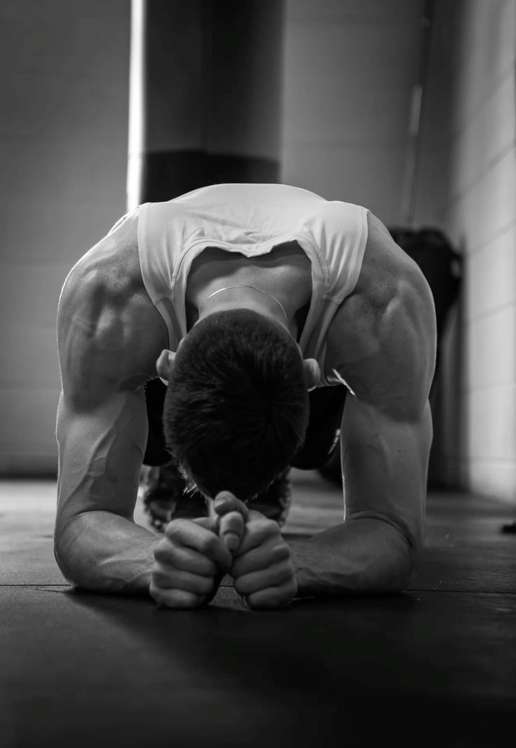 Athlete stretching on a gym floor